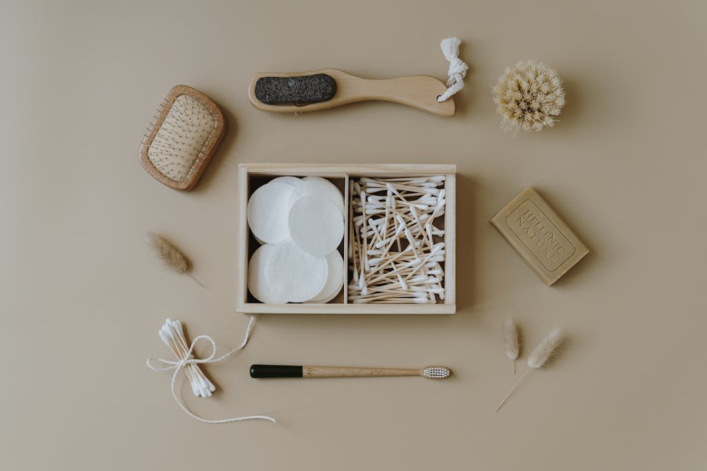 Flat lay of eco-friendly bath products including brushes and cotton buds for sustainable living.